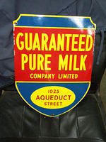 $OLD Guaranteed Pure Milk Porcelain Sign